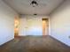 A basic bedroom with two open doorways, perfect for a simple living space at 7523 Greystone Dr # 35, Hudson, FL 34667