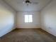 A basic bedroom with a ceiling fan and a window, perfect for a simple living space at 7523 Greystone Dr # 35, Hudson, FL 34667