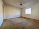 Bright bedroom with a ceiling fan and a window, offering a blank canvas for personalization at 7523 Greystone Dr # 35, Hudson, FL 34667