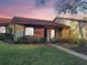 Cozy single-story home featuring a manicured lawn and mature landscaping, offering comfortable suburban living at 7523 Greystone Dr # 35, Hudson, FL 34667