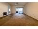 Expansive living room space with sliding glass doors leading to outdoor area, ready for updates at 7523 Greystone Dr # 35, Hudson, FL 34667