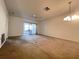 Empty Living Room with old carpet and sliding glass door at 7523 Greystone Dr # 35, Hudson, FL 34667