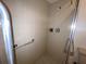 A standard shower with accessible grab bar at 7523 Greystone Dr # 35, Hudson, FL 34667
