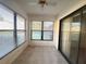 Sunroom with tile flooring, natural light, and sliding glass doors at 7523 Greystone Dr # 35, Hudson, FL 34667