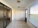 Sunroom with tile flooring and sliding glass doors at 7523 Greystone Dr # 35, Hudson, FL 34667
