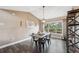 Cozy dining room featuring contemporary furnishings, natural lighting, and a comfortable, inviting space at 7842 Leighton Cir, New Port Richey, FL 34654