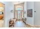 Bright foyer with hardwood floors, decorative lighting, and a welcoming atmosphere at 7928 Fashion Loop, New Port Richey, FL 34654