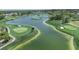 Aerial photograph captures golf course and lake in a lush, green landscape with surrounding homes at 8157 Hidden Hills Dr, Spring Hill, FL 34606