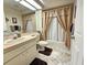Neutral toned bathroom featuring a shower-tub combo and traditional vanity at 8157 Hidden Hills Dr, Spring Hill, FL 34606