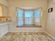 Bright dining space with a bay window and a cozy window seat at 8157 Hidden Hills Dr, Spring Hill, FL 34606