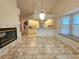 Spacious dining area with fireplace and tiled floor, adjacent to kitchen at 8157 Hidden Hills Dr, Spring Hill, FL 34606