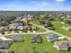 Aerial view of homes in a community with mature trees, and well-maintained landscaping at 8983 Wade St, Brooksville, FL 34613