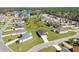 Aerial view of a neighborhood featuring well-maintained homes and green lawns at 8983 Wade St, Brooksville, FL 34613