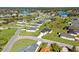 This is an aerial view of the homes in this community with a pond in the background at 8983 Wade St, Brooksville, FL 34613