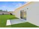 Spacious backyard with a patio area and lush green grass at 8983 Wade St, Brooksville, FL 34613