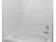 Clean, bright bathroom with a white tiled shower and tub at 8983 Wade St, Brooksville, FL 34613