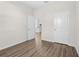 Bedroom featuring wood-look flooring, neutral walls, and natural light at 8983 Wade St, Brooksville, FL 34613