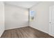 Bright bedroom with hardwood floors and a window offering natural light at 8983 Wade St, Brooksville, FL 34613