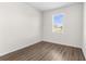 Cozy bedroom with natural light and wood-look flooring at 8983 Wade St, Brooksville, FL 34613