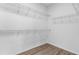 Walk-in closet with lots of shelving for ample storage and laminate floors at 8983 Wade St, Brooksville, FL 34613