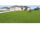 Well-maintained house with a manicured lawn and an attached two car garage at 8983 Wade St, Brooksville, FL 34613