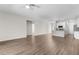 Open concept living room with wood-look flooring, lots of space, and an island kitchen at 8983 Wade St, Brooksville, FL 34613
