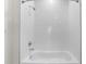 Modern shower with white subway tile surround and chrome showerhead and faucet fixtures at 8983 Wade St, Brooksville, FL 34613