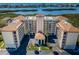 Waterfront condo complex boasts lush landscaping, covered parking, and beautiful water views at 9000 Commodore Dr # 302, Seminole, FL 33776