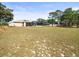 The exterior of the house has a screened-in porch and backyard at 10188 Whisper Ridge Trail Trl, Weeki Wachee, FL 34613