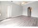 Spacious bedroom with hardwood floors, fan, and neutral colors at 10188 Whisper Ridge Trail Trl, Weeki Wachee, FL 34613