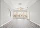 Bright bedroom with hardwood floors, fan, recessed lighting, and natural light from large windows at 10188 Whisper Ridge Trail Trl, Weeki Wachee, FL 34613