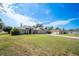 Charming exterior of the house with a well-manicured lawn and a three-car garage at 10188 Whisper Ridge Trail Trl, Weeki Wachee, FL 34613