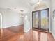 Bright foyer features hardwood flooring and an elegant chandelier at 10188 Whisper Ridge Trail Trl, Weeki Wachee, FL 34613