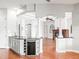 Kitchen area with wine fridge and easy access to dining and living area with fireplace at 10188 Whisper Ridge Trail Trl, Weeki Wachee, FL 34613