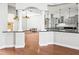 Modern kitchen with granite countertops, stainless steel appliances and pendant lights at 10188 Whisper Ridge Trail Trl, Weeki Wachee, FL 34613