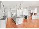 Spacious kitchen features an island, hardwood floors, granite countertops, and modern appliances at 10188 Whisper Ridge Trail Trl, Weeki Wachee, FL 34613