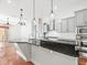 Modern kitchen featuring granite island, stainless appliances, and ample cabinet space at 10188 Whisper Ridge Trail Trl, Weeki Wachee, FL 34613
