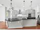 Stylish kitchen with large island, granite countertops, and stainless steel appliances at 10188 Whisper Ridge Trail Trl, Weeki Wachee, FL 34613