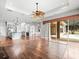 Living Room with open floorplan and views into the Kitchen area and backyard at 10188 Whisper Ridge Trail Trl, Weeki Wachee, FL 34613