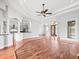 Open-concept living room featuring hardwood floors and modern design elements at 10188 Whisper Ridge Trail Trl, Weeki Wachee, FL 34613