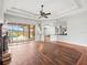 Bright living room with hardwood floors, fireplace, and open concept to the kitchen at 10188 Whisper Ridge Trail Trl, Weeki Wachee, FL 34613