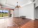 Living Room featuring hardwood floors, sliding glass door to the porch and backyard at 10188 Whisper Ridge Trail Trl, Weeki Wachee, FL 34613