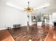 Open floorplan with living room connected to the kitchen with granite countertops and hardwood floors at 10188 Whisper Ridge Trail Trl, Weeki Wachee, FL 34613