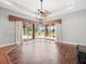 Living Room featuring hardwood floors, sliding glass doors to the porch and view of pool at 10188 Whisper Ridge Trail Trl, Weeki Wachee, FL 34613