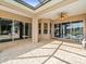 Covered patio with brick flooring and ceiling fan, great for entertaining at 10188 Whisper Ridge Trail Trl, Weeki Wachee, FL 34613