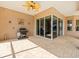 Open brick patio with grill and seating, perfect for a BBQ at 10188 Whisper Ridge Trail Trl, Weeki Wachee, FL 34613