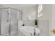 Bathroom featuring a separate shower and soaking tub at 11700 Leda Ln, New Port Richey, FL 34654