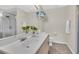 Bathroom with a double sink vanity and shower at 11700 Leda Ln, New Port Richey, FL 34654