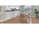Bright dining area adjacent to the kitchen with a breakfast bar and seating at 11700 Leda Ln, New Port Richey, FL 34654