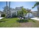Inviting single-story home featuring a well-manicured lawn and a two-car garage at 11700 Leda Ln, New Port Richey, FL 34654